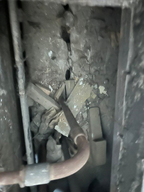 Close-up of a suspected asbestos-containing ceiling material